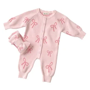 Cute pink knit baby romper and headband set with lovely bow pattern for infant autumn wear.