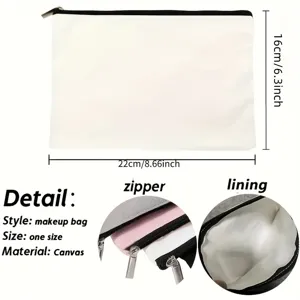 Vue rapprochée d'une trousse de maquillage en toile blanche avec fermeture éclair et doublure.