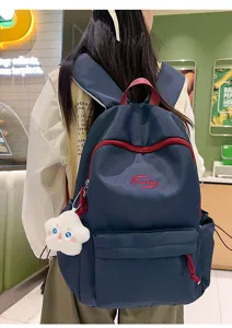 Mochila casual elegante para chicas estudiantes, bolso escolar de gran capacidad con colgante.