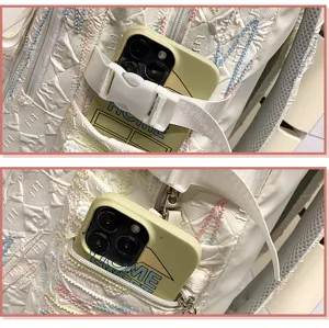 Detailed view of the casual backpack pocket featuring a secure buckle and smooth zipper.