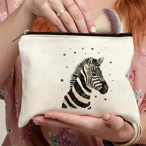 Borsa per cosmetici in tela con stampa zebra e stelle, chiusura lampo resistente.