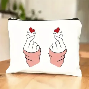 Canvas cosmetic bag detail, cute finger heart print, neat zipper closure and smooth fabric.