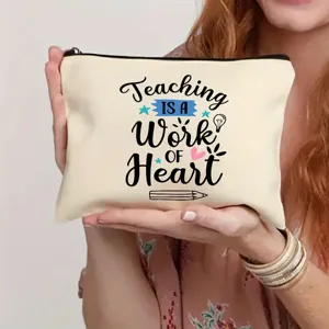 Close-up detail shot of a canvas makeup bag featuring teacher theme quote print and zipper.
