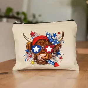 Detailed view of canvas cosmetic makeup bag featuring cute patriotic Highland cow print design.