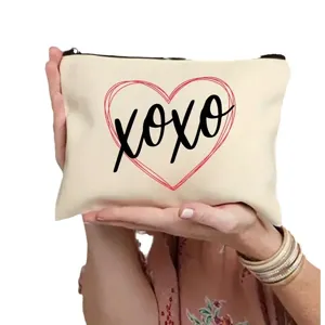 Canvas cosmetic bag with red heart and XOXO print, ideal student storage zipper pouch for daily use.