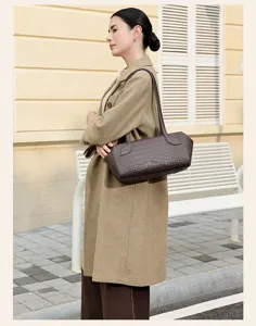 Brown crocodile pattern leather shoulder bag, stylish boston pillow handbag for women commuting daily.