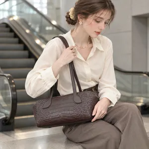 Stylish leather Boston shoulder handbag for women, elegant daily commute tote bag with top handles.