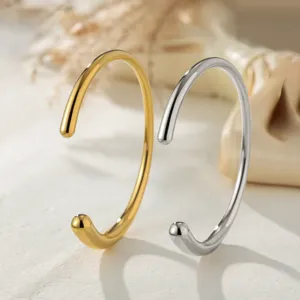 Minimalist smooth open-ended metal bangles, stylish titanium steel couple bracelets for daily wear.