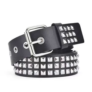 Close-up detail of black leather punk belt featuring three rows of silver pyramid metal studs.