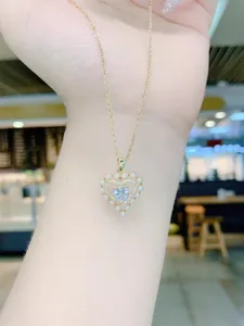 Close-up detail of the elegant heart-shaped pearl and zirconia pendant necklace for daily wear.