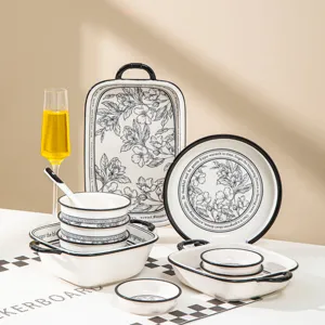 Set di stoviglie in ceramica con design floreale bianco e nero, ideale per cucina e casa.