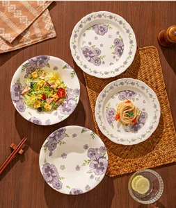 Ceramic dinnerware set with purple floral underglaze design, beautiful plates and bowls.