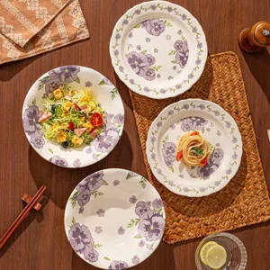 Purple floral ceramic dinnerware set including bowls and plates for stylish table setting main.