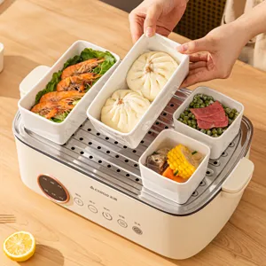 Elektrischer Dampfgarer mit weißen Keramikschüsseln für die Küche im modernen Haushalt.