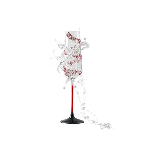 Elegant crystal champagne glass with red gradient stem and decorative beads for wedding toast.
