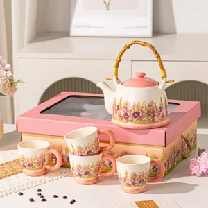 Pastoral ceramic tea set with teapot and four cups, ideal for elegant afternoon tea and gifts.