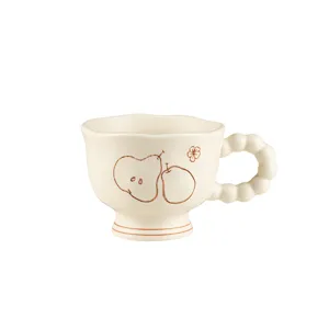 Vintage ceramic mug with pear pattern, matte glaze, irregular rim and bubble handle.