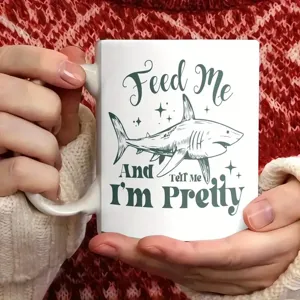 White ceramic coffee mug featuring funny shark graphic and typography for office daily use.
