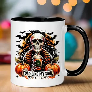 Detailed close-up of a ceramic coffee mug featuring a unique Halloween skeleton design.