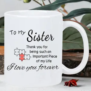 White ceramic coffee mug with sister appreciation text and puzzle graphic for daily use.