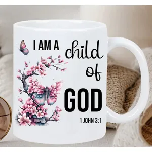 White ceramic coffee mug with religious quote and butterfly cherry blossom print detail 11oz