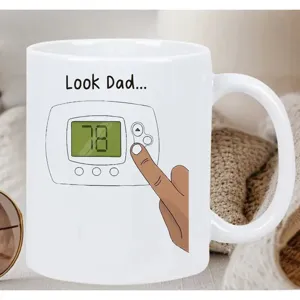 White ceramic coffee mug with funny thermostat illustration, perfect office gift cup for dad.