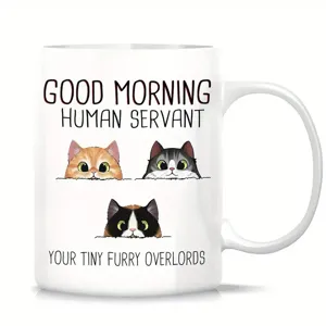 Detailed view of white ceramic coffee mug with cute cat illustrations and funny text.