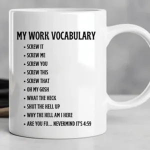 White ceramic coffee mug detail showcasing funny office work vocabulary text print design.