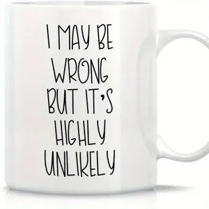White ceramic coffee mug detail showing funny quote text print design close up view.