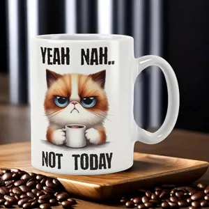Ceramic coffee mug with funny grumpy cat print and text, perfect for office and daily use. White.