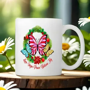 White ceramic coffee mug featuring colorful butterflies and elegant floral wreath design.