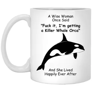 Close-up view of white ceramic coffee mug featuring custom orca graphic print design.