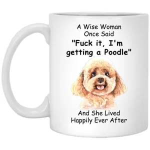 Ceramic coffee mug detail showing cute poodle dog illustration and funny quote text print.