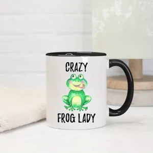 Keramik Kaffeetasse mit lustigem Frosch Motiv und schwarzem Henkel, ideal für das Büro.