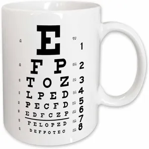 White ceramic mug featuring a classic eye chart print design, ideal for daily coffee or tea use.