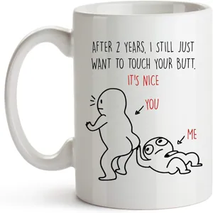 White ceramic coffee mug with funny novelty cartoon text print, perfect romantic gift for couples.