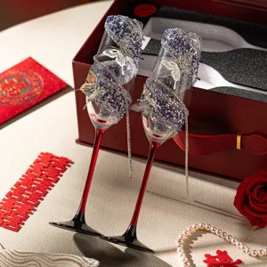 Elegant rhinestone butterfly champagne glasses set for wedding toast and bridal gifts.