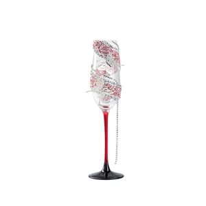 Elegant rhinestone champagne flute with silver butterfly decor, perfect for weddings and parties.