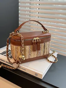 Stylish woven box handbag with chain strap and zipper closure, perfect for travel and casual wear.