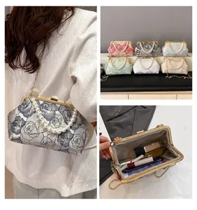 Detailed view of the Chinese style embroidered pearl chain shoulder bag and interior space.