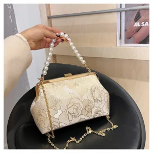 Exquisite floral embroidered handbag detail, vintage clasp design with elegant pearl handle.