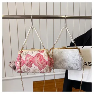 Elegant Chinese style jacquard handbag with pearl chain handle and floral embroidery design.