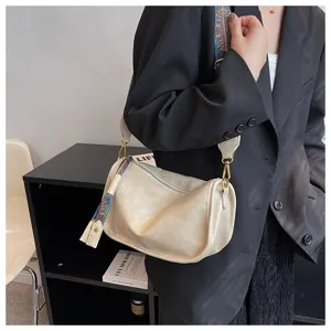 Soft leather pillow shoulder bag for women, casual crossbody bag with wide ethnic strap.