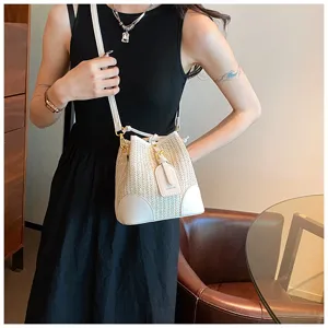 Stylish white woven bucket bag for women, chic straw crossbody shoulder bag for summer.
