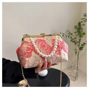Elegant Chinese style floral jacquard handbag with pearl handle and metal chain for women.