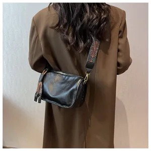 Soft leather shoulder bag casual pillow crossbody bag with wide patterned strap for women.