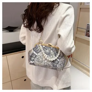 Elegant embroidered jacquard shoulder bag with pearl handle and metal chain strap for women.