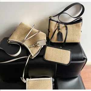 Summer woven straw hobo and bucket bag set with contrast leather trim for women casual wear.