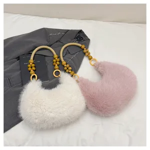 Fluffy plush crescent handbag with wooden beaded handle winter shoulder bag detail view.