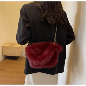 Stylish women faux fur crossbody bag with chain strap, soft plush shoulder handbag for autumn.